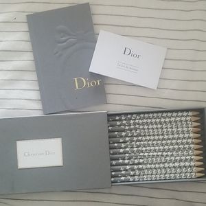 Christian Dior notebook and pencil set.